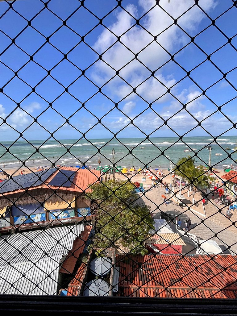 Frente-mar com vista da praia no centro da vila