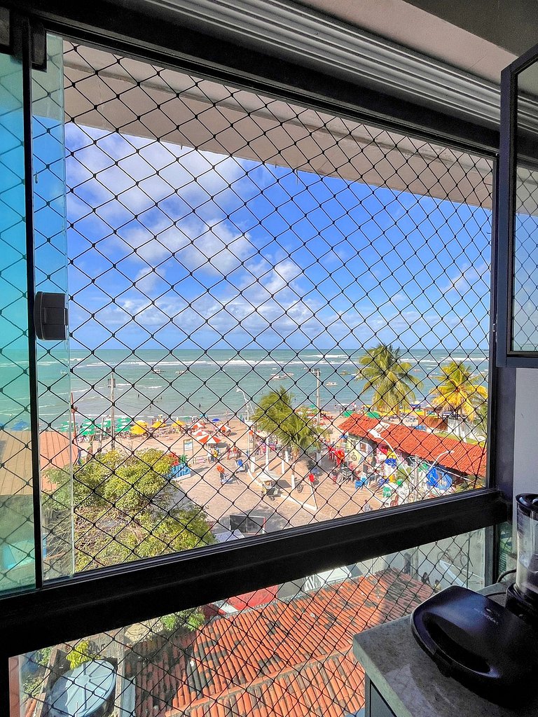 Frente-mar com vista da praia no centro da vila